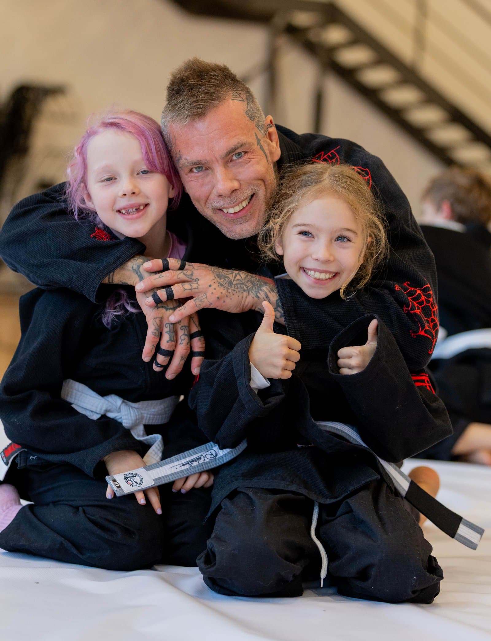 Miko Hytönen teaching students on the mat